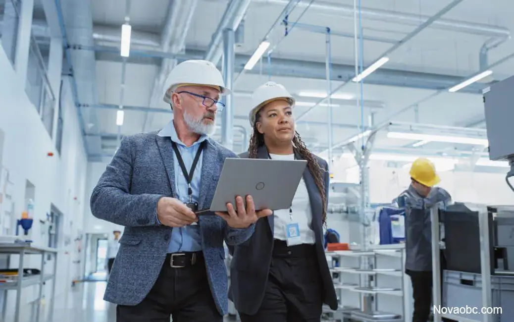 Logistics managers coordinating production in advanced manufacturing plant